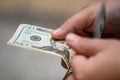 Closeup of male hands counting USD banknotes - world money, inflation and economy concept Royalty Free Stock Photo