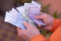 closeup male hands hold Moroccan dirham money, count paper dirham banknotes, concept cash payments, monetary savings, save for