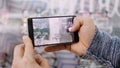 Closeup of male hands holding smartphone and taking a photo of glasses at optician retail store, Eyeglasses shop, for Royalty Free Stock Photo