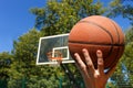 Hands throwing basketball ball Royalty Free Stock Photo