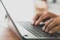 Closeup of male hands typing on the computer keyboard, businessman or student using laptop at home, online learning, internet mark Royalty Free Stock Photo