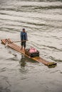 Closeup of male vendor on his raft on Li River in Guilin, China