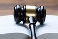 Mallet On Open Legal Book In Courtroom Royalty Free Stock Photo