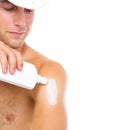 Closeup on man applying sun screen creme on arm Royalty Free Stock Photo