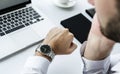 Closeup of man checking time on hand watch Royalty Free Stock Photo