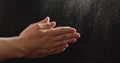 closeup man clapping hands with fine powder Royalty Free Stock Photo