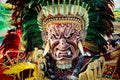 Closeup man in colorful native indian mask poses for photo at dominican carnival