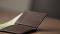 closeup man counting money in brown leather wallet Royalty Free Stock Photo