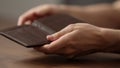 closeup man counting money in brown leather wallet Royalty Free Stock Photo