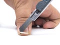 Closeup of a man cutting nails by rusty cutter Royalty Free Stock Photo