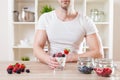 Closeup on man with delicious yoghurt with fresh berries Royalty Free Stock Photo