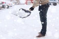 Closeup of man digging snow with shovel near car Royalty Free Stock Photo