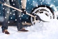 Closeup of man digging snow with shovel near car Royalty Free Stock Photo