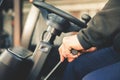 Closeup Man drives a reliable heavy truck Caterpillar, loader Royalty Free Stock Photo