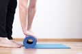 Closeup of man feet and hands with exercise yoga mat Royalty Free Stock Photo
