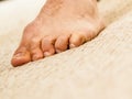 Closeup of man foot standing on carpet Royalty Free Stock Photo