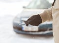 Closeup of man hand with car key outdoors Royalty Free Stock Photo