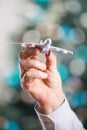 Closeup of man hand holding model of airplane Royalty Free Stock Photo