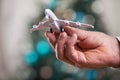 Closeup of man hand holding model of airplane Royalty Free Stock Photo