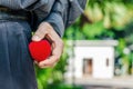 Man is hand put in or taking out a wedding box ring in the worn pocket. Concept of asking in marriage. Royalty Free Stock Photo