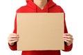Closeup of man hands holding blank cardboard placard, isolated on white background. Teenage boy holding empty banner Royalty Free Stock Photo