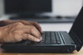 Closeup man hands typing on a computer keyboard, businessman or student using laptop at home, online learning, internet marketing, Royalty Free Stock Photo