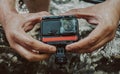 Closeup of a man holding a GoPro camera Royalty Free Stock Photo