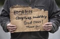 Closeup man holding Homeless handmade cardboard sign, dirty hands, unemployed, job