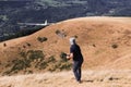 Closeup of a man launches a radio-controlled model glider during an aircraft modeling competition