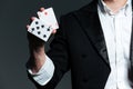 Closeup of man magician holding two playing cards Royalty Free Stock Photo