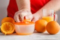 Closeup on man making fresh orange juice Royalty Free Stock Photo