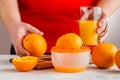 Closeup on man making fresh orange juice Royalty Free Stock Photo