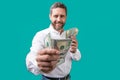 closeup of man paying money dollars at studio. man paying money dollars. selective focus Royalty Free Stock Photo