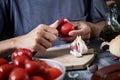 Man peeling scalded tomatoes