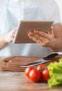 Closeup of man pointing finger to tablet pc Royalty Free Stock Photo