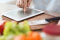 Closeup of man pointing finger to tablet pc Royalty Free Stock Photo