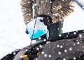 Closeup of man pouring antifreeze into car