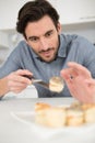 closeup man preparing tapas at home