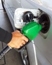 Closeup of man pumping gasoline fuel in car Royalty Free Stock Photo