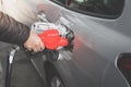 Closeup of man pumping gasoline fuel in car at gas station. Royalty Free Stock Photo