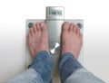 Man`s feet on weight scale - Diabetes