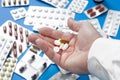 Closeup of a man`s hand with several different pills Royalty Free Stock Photo