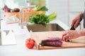 Closeup man's hands cutting vegetables in a kitchen Royalty Free Stock Photo