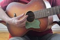Closeup of man`s hands playing acoustic guitar. Musical concept Royalty Free Stock Photo