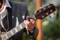 Closeup of man`s hands playing acoustic guitar. Musical concept. Royalty Free Stock Photo