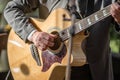 Closeup of man`s hands playing acoustic guitar. Musical concept. Royalty Free Stock Photo