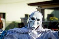 Closeup man in scary white skeleton costume poses for photo at dominican carnival