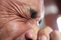 Closeup of man sneezing and squeezing eyes closed. Royalty Free Stock Photo