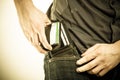 Closeup. Man taking wallet out on his pocket. Pay and theft. Royalty Free Stock Photo