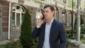 Closeup man talking phone outdoor. Man discussing business issue at street Royalty Free Stock Photo